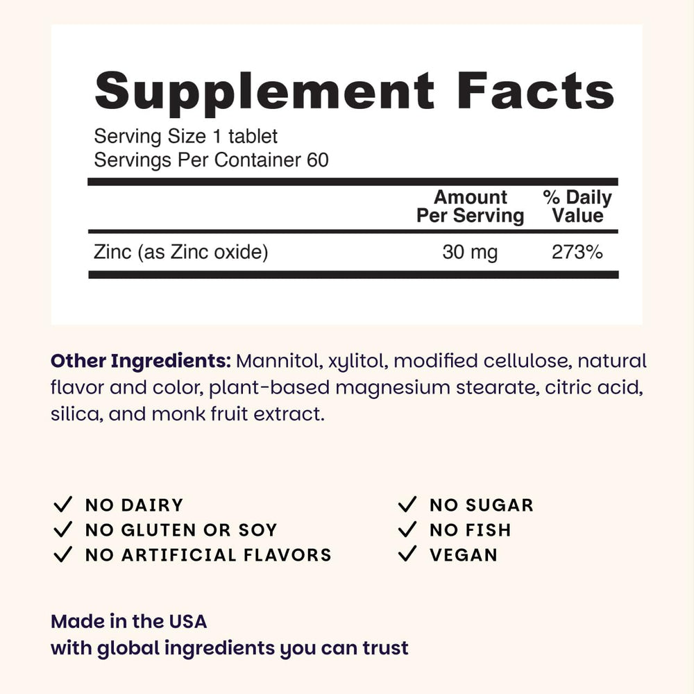Dissolving blueberry-flavored zinc lozenge on tongue