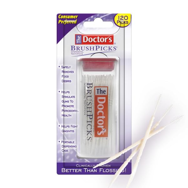 Close-up of interdental brush head with soft bristles between teeth