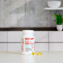 Close-up of salmon oil capsules showing DHA and EPA