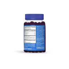 Open bottle with Snoozeberry gummies spilling from the container