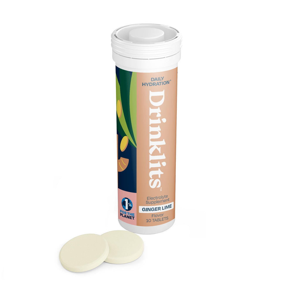 Drinklits ginger lime effervescent tablet dissolving for crisp hydration and zero sugar.