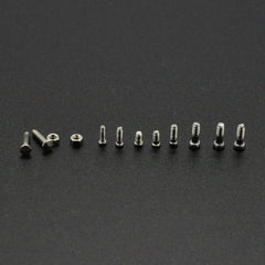 Close-up of micro screws and nuts in a transparent box