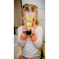 Natural ingredients laid out: bentonite clay, sea salt, essential oils