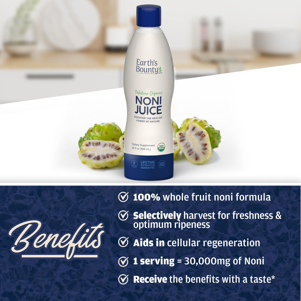 Fresh noni fruit and leaves near bottle