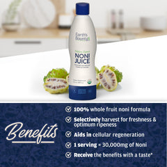 Fresh noni fruit and leaves near bottle