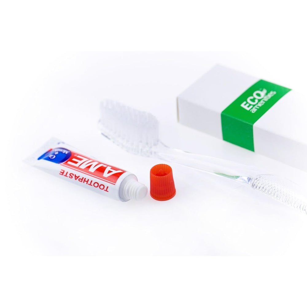Mini toothbrush with peppermint toothpaste close-up