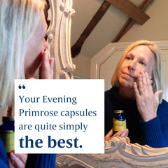 Box and bottle of Efamol Evening Primrose Oil on white background