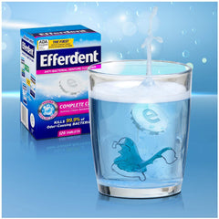 Denture cup with Efferdent tablet ready to soak