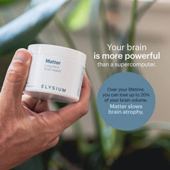 Lifestyle shot of ELYSIUM Matter on desk with notebook