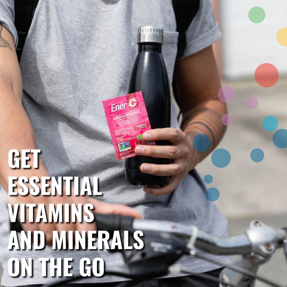 Hand stirring Ener-C drink in water