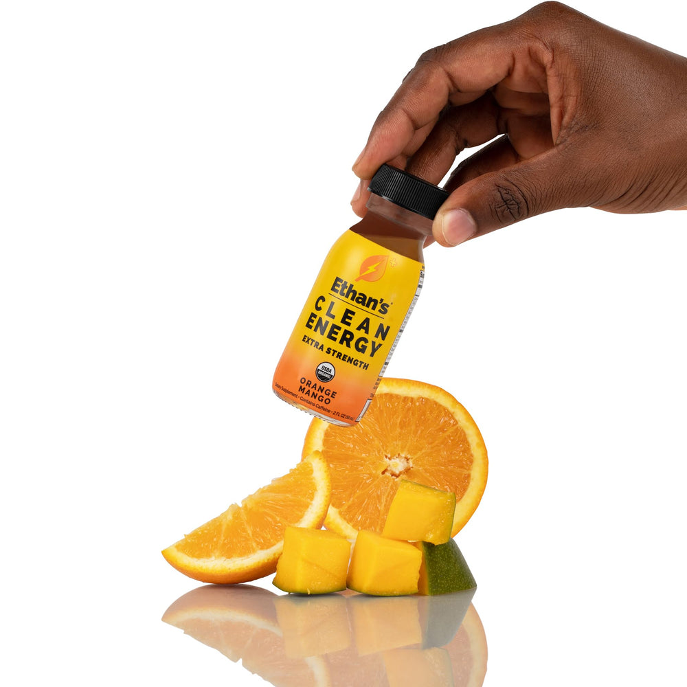 Recyclable glass bottles for Ethan's Organic Energy Shots with orange mango flavor