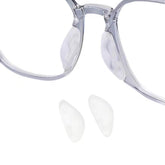 Front view of soft silicone eyeglass nose pads in packaging