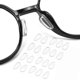 Black adhesive airbag eyeglass nose pads close up