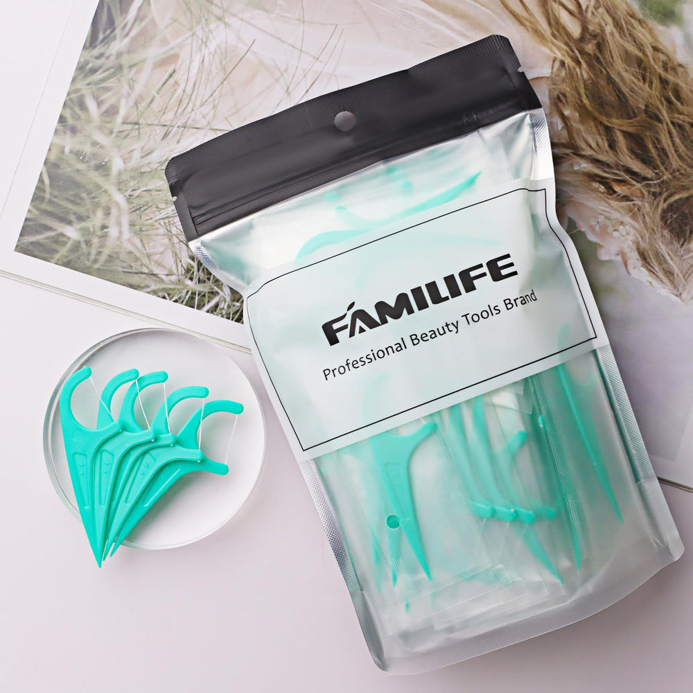 Floss picks removing food debris between teeth