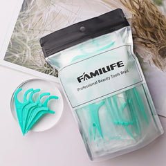 Floss picks removing food debris between teeth