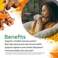 Scoop pouring curcumin powder into a recipe