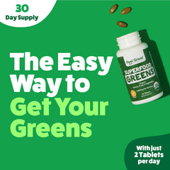 Close-up of green tablets on a white surface