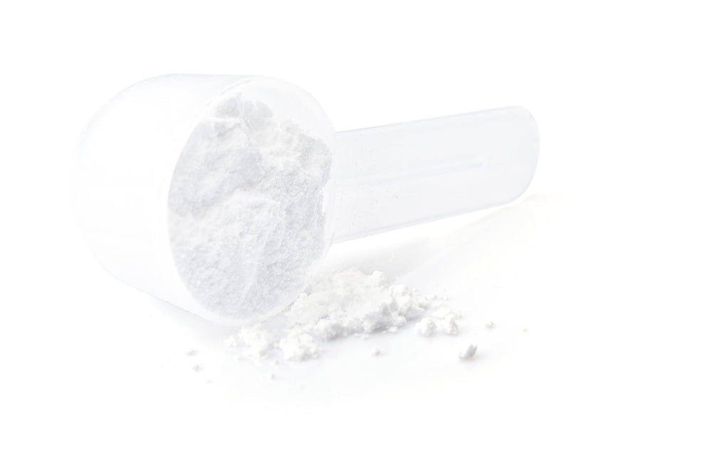 Flat lay of FIOR Creatine packaging and scoop