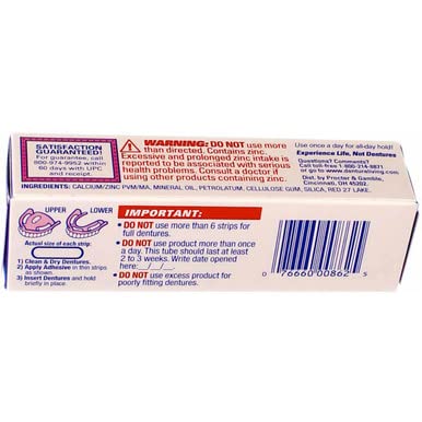 In-use denture adhesive with dentures