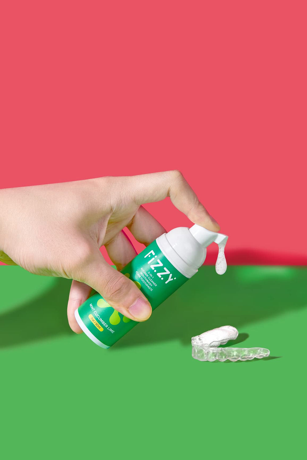 Hands applying 1-2 pumps to an aligner