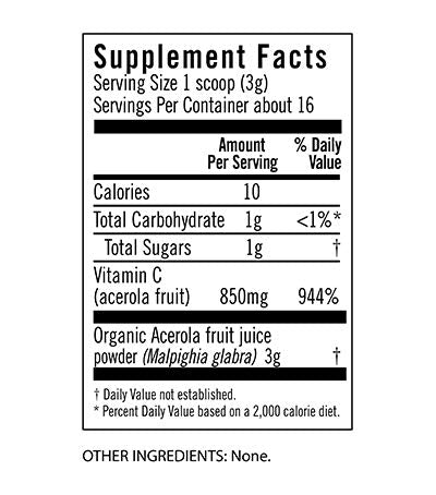 Serving scoop of Acerola Powder beside a glass