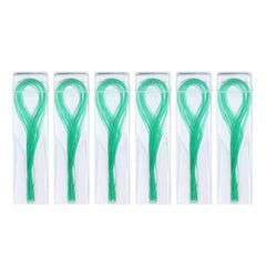 Close-up of green floss threader with flexible tip for tight spaces