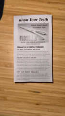 Close-up of FLOSSAID floss holder showing angled head and colors