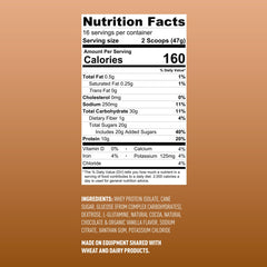 Scoop of Fluid Recovery powder beside a glass of chocolate shake