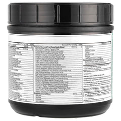 Serving scoop of greens powder with a glass of water