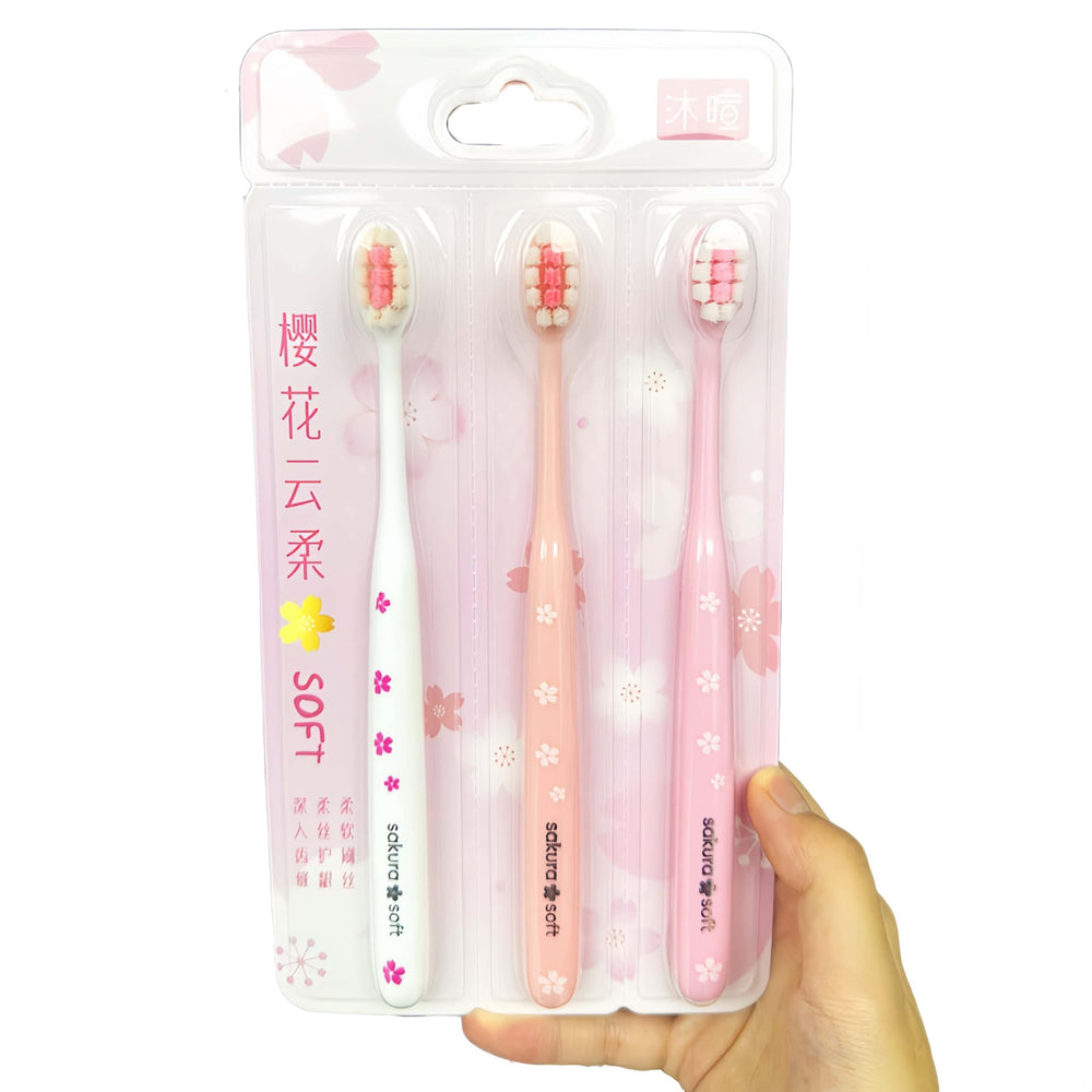 Wide head pink toothbrush with sakura pattern