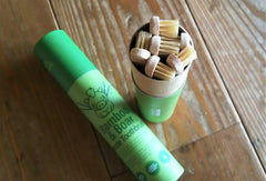 Six toothbrushes in a paperboard tube packaging