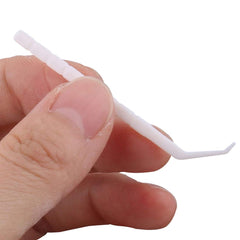 Usage image showing GARASANI toothpick cleaning between teeth