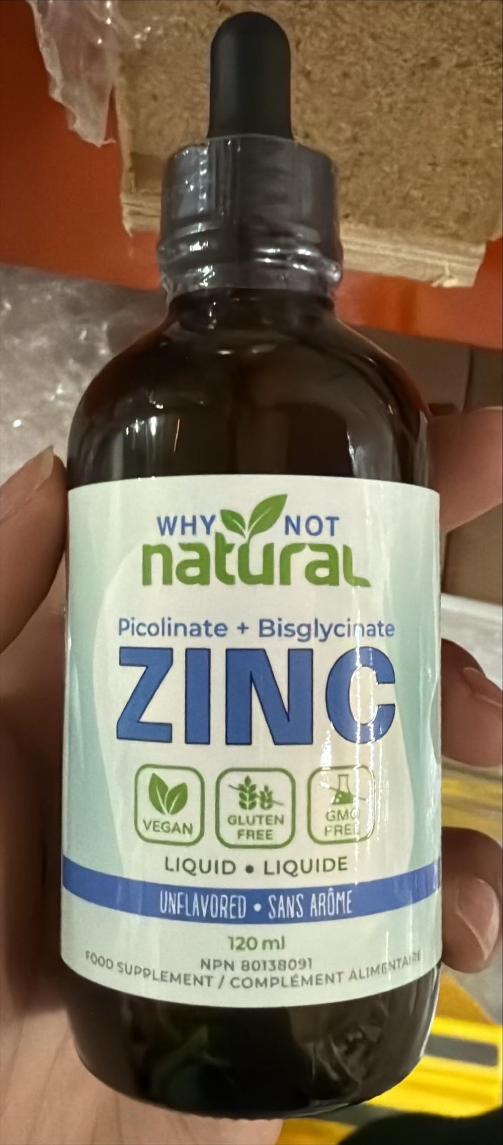 Glass dropper dispensing liquid zinc drops