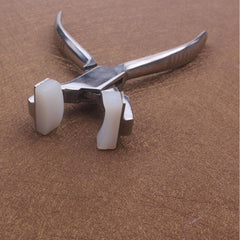 Close-up of eyeglasses repair tool for frame arms