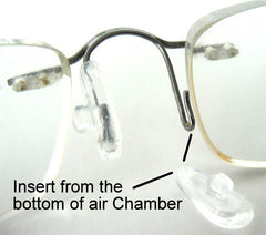 Nose pads on a glasses frame ready for install