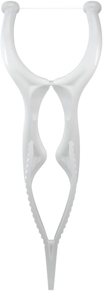 Floss pick tip reaching between teeth for thorough cleaning