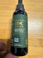 Global Healing Zinc Liquid bottle in lifestyle setting