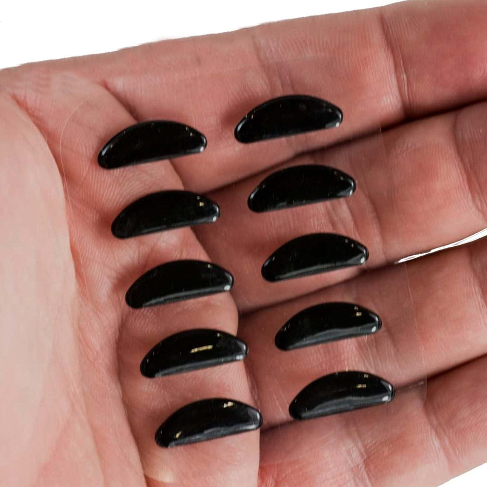 Five pairs per package — black nose pads