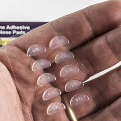 Anti-slip nose pads applied to eyeglass frame, clear