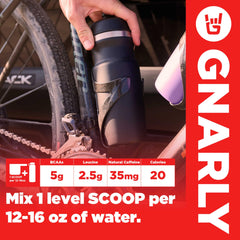 Mixing Gnarly BCAA Powder Berry Lemonade in a glass