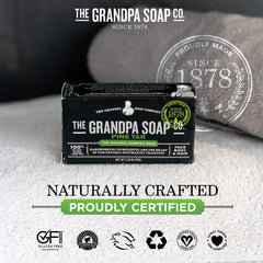 Pine tar soap bar with natural earthy background