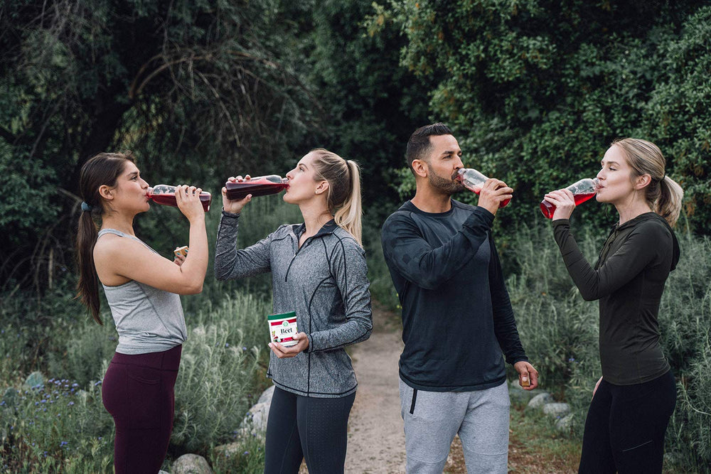 Beet powder being poured into a glass
