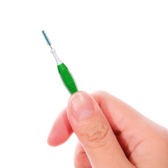 Compact, travel-friendly interdental brush for on-the-go use