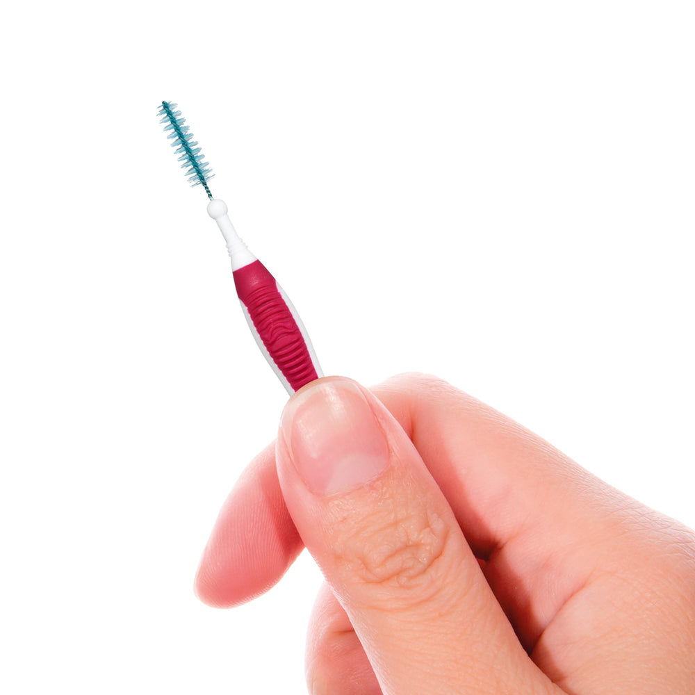 Interdental cleaner removing plaque between moderately spaced teeth