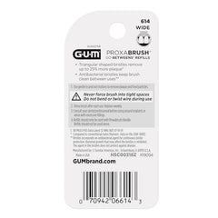 Wide interdental brush positioned between teeth