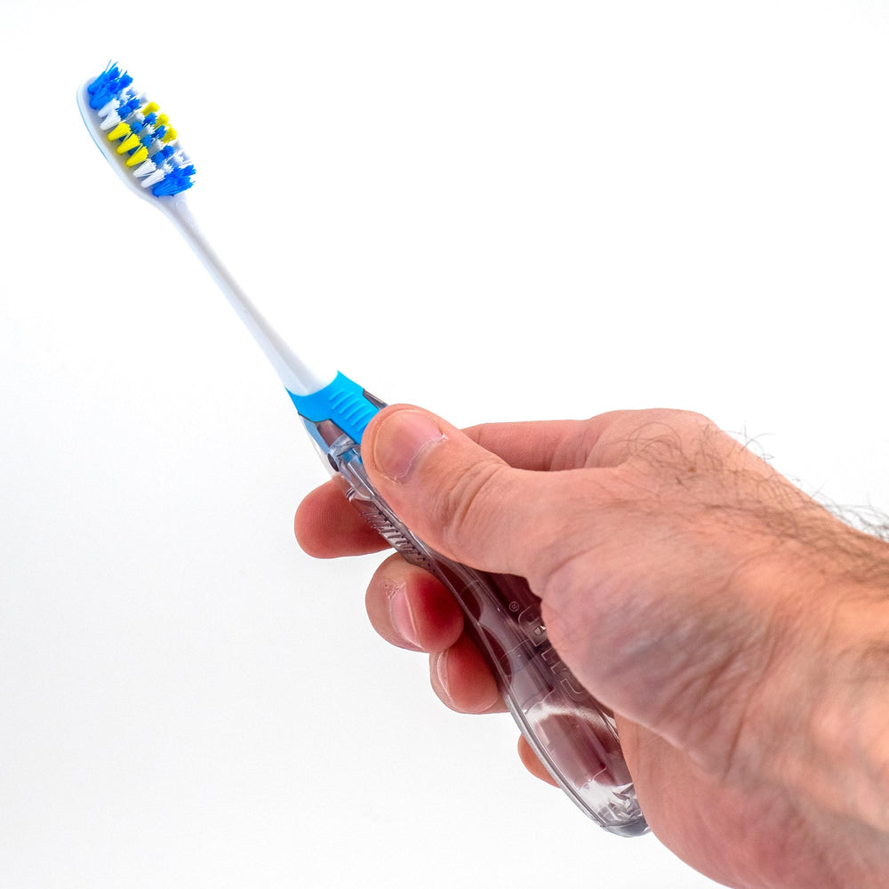 Toothbrush with built-in tongue cleaner