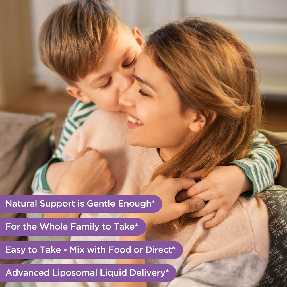 Dropper dispensing saffron liquid into a glass