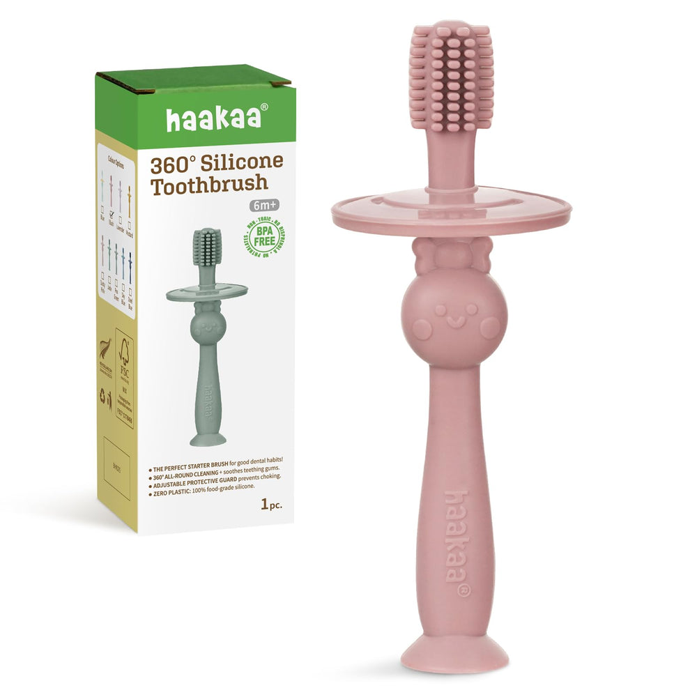 Haakaa 360° Baby Toothbrush with suction base in blush color