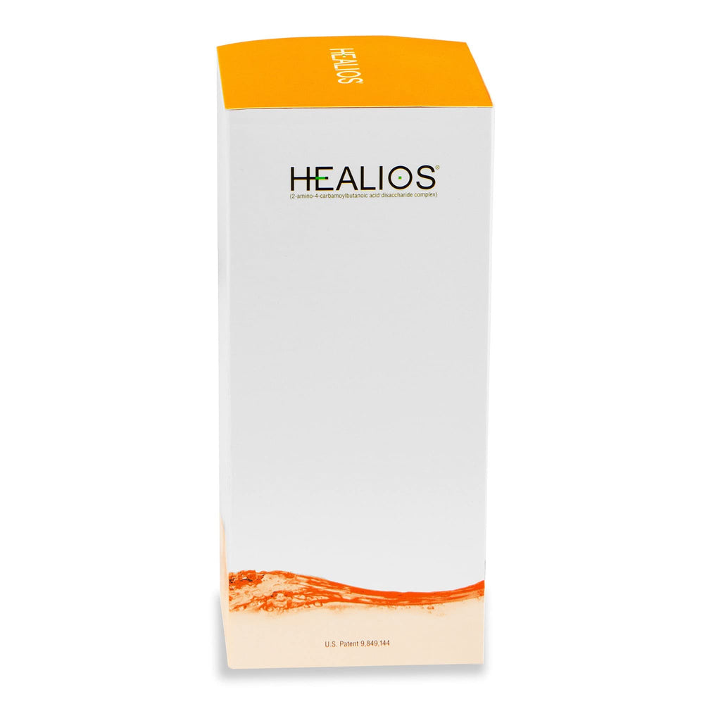 Scoop of Healios orange flavor powder with measuring scoop
