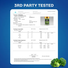 Pill bottle with capsules beside organic greens